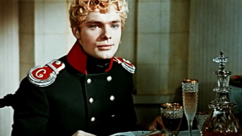 Метель 1964 г. (кадр из фильма). Молодой офицер сидит за накрытым столом.